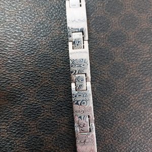 Bracelet articulé en acier de damas